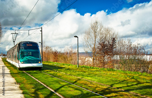 Tram rails on a green lawn