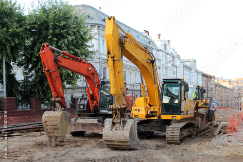 two modern excavators working on the Lvov's street