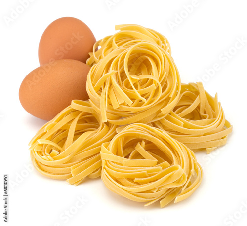 Italian egg pasta nest isolated on white background
