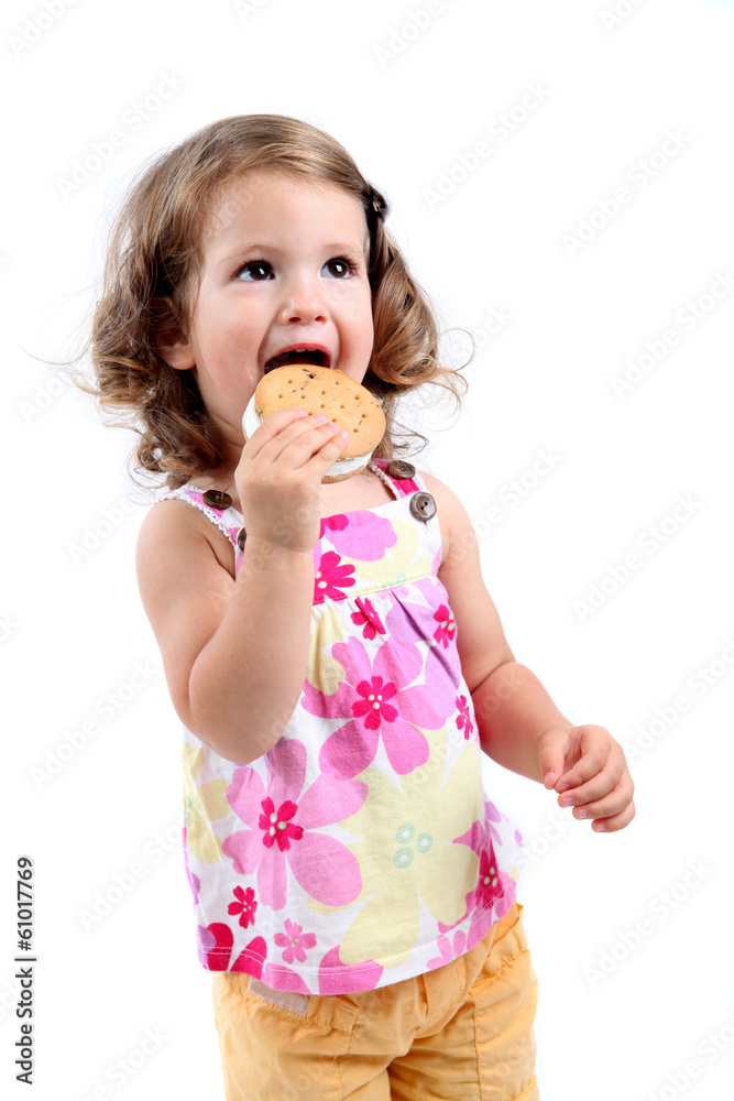 little girl eating sandwich ice cream, isolated little girl eating sandwich ice cream, isolated
