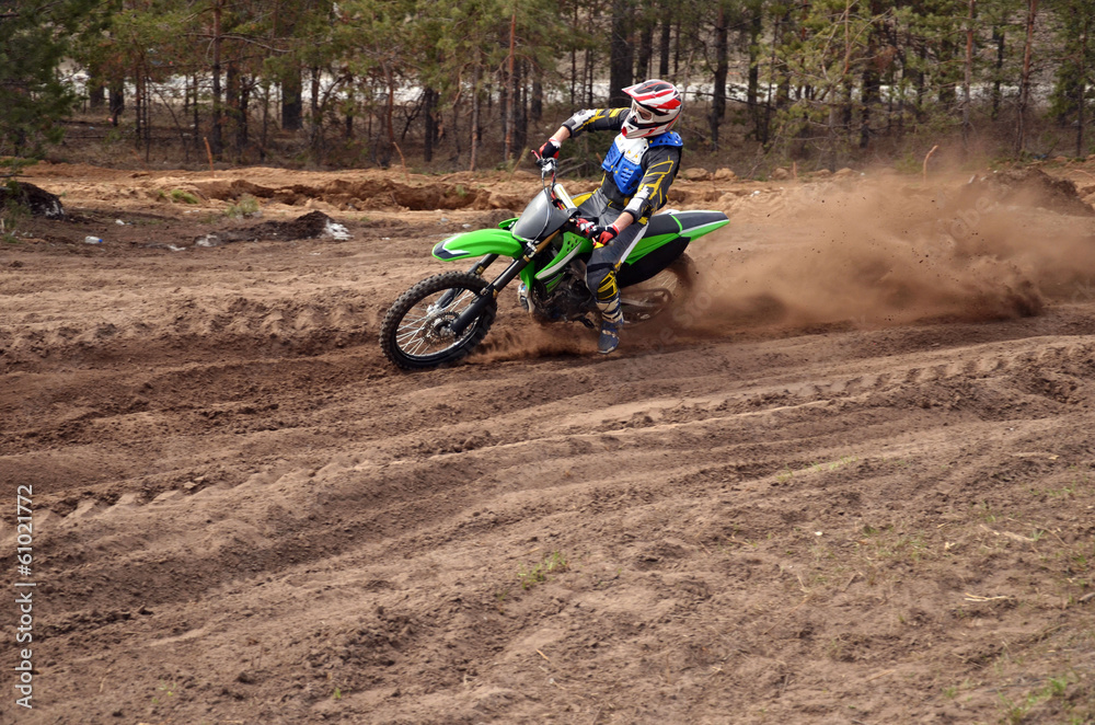 MX rider turns point-blank of sand MX rider turns point-blank of sand