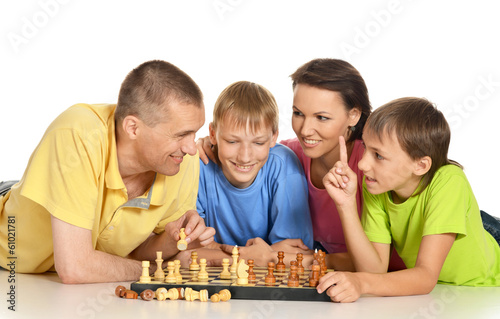 Two guys and their grandparents playing chess