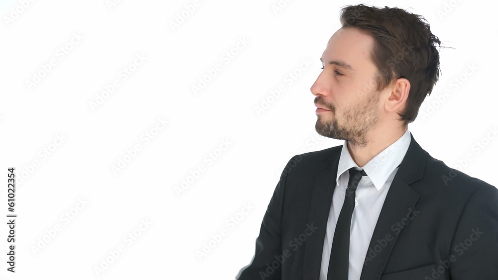Handsome businessman writing on a virtual screen Handsome businessman writing on a virtual screen