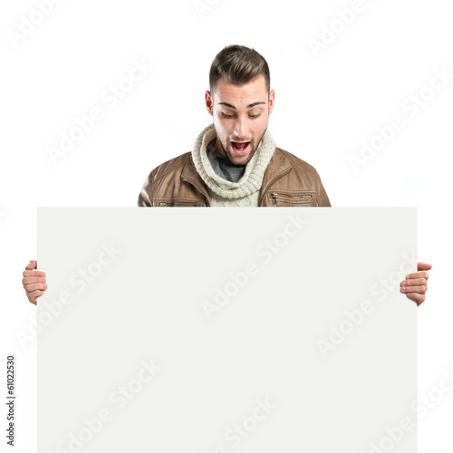 Younh man with a white cardboard photo
