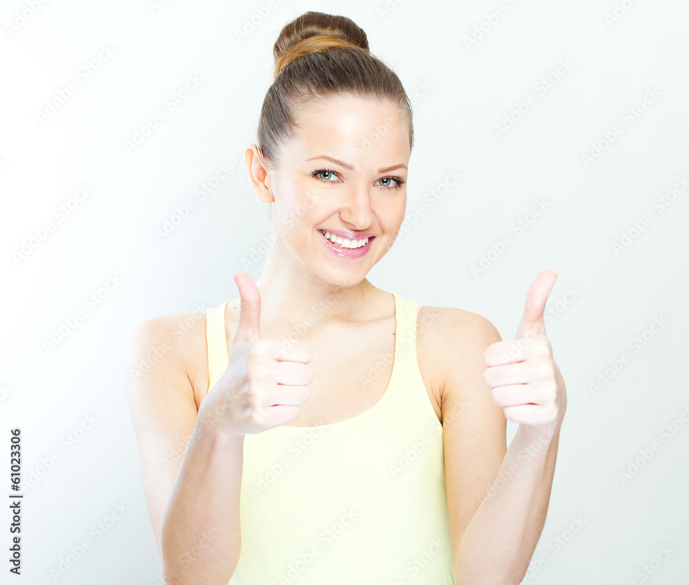 Pretty girl gives thumb up, isolated on white Pretty girl gives thumb up, isolated on white