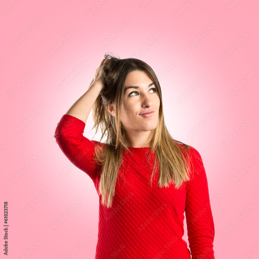 Young girl thinking over isolated pink background Young girl thinking over isolated pink background