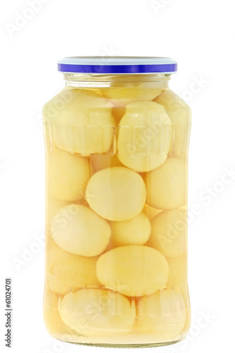 A jar of small whole white potatoes in salted water