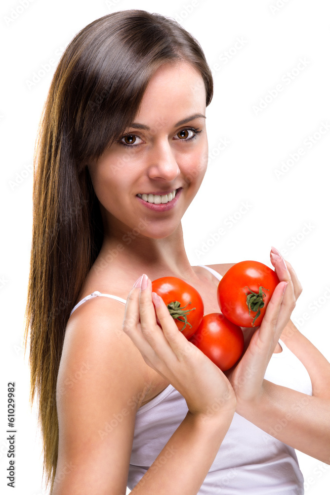 Healthy lifestyle! Pretty woman holding a tomato Healthy lifestyle! Pretty woman holding a tomato
