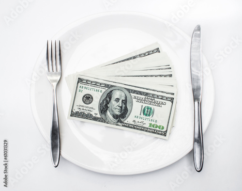 American US dollars in the white plate.