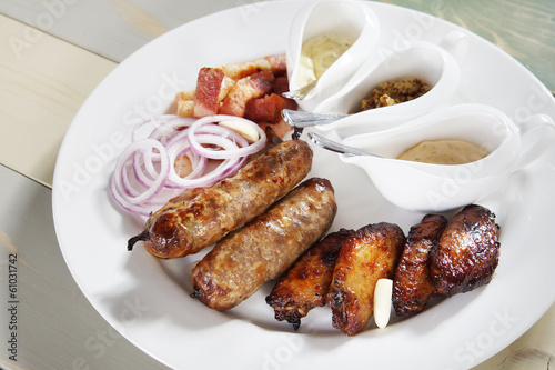 Grilled sausages with chicken legs