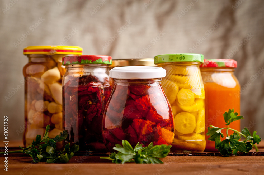 Composition with jars of pickled vegetables. Marinated food. Composition with jars of pickled vegetables. Marinated food.