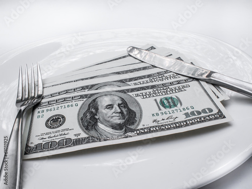 American US dollars in the white plate. photo