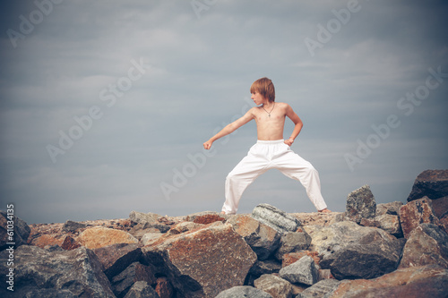Young boy training karate