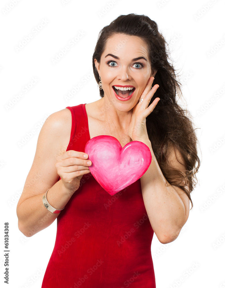 Beautiful surprised woman holding a love heart Beautiful surprised woman holding a love heart