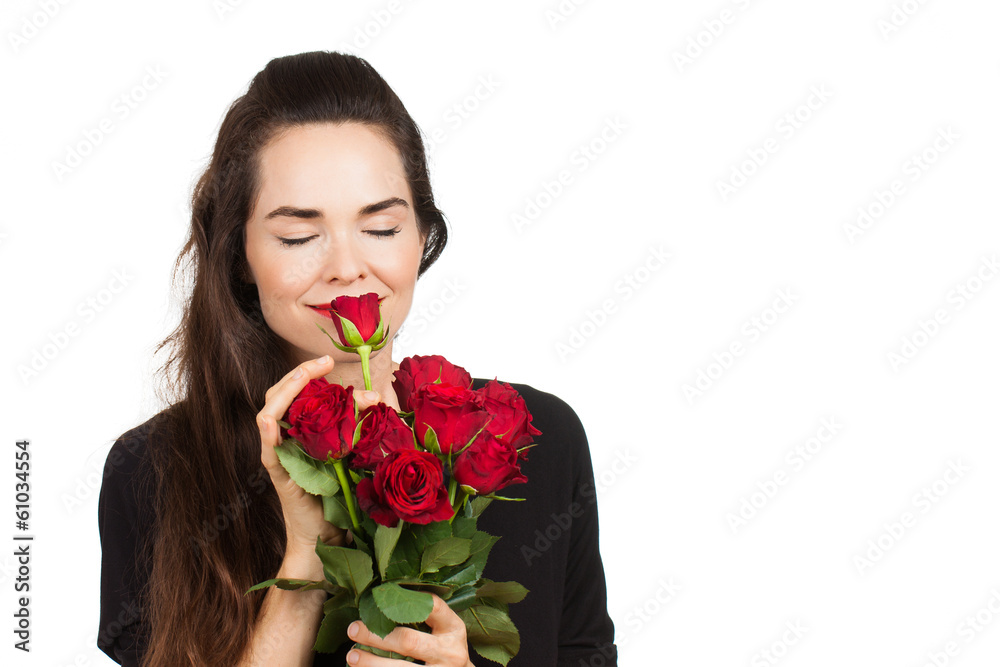 Woman smelling bunch of roses Woman smelling bunch of roses