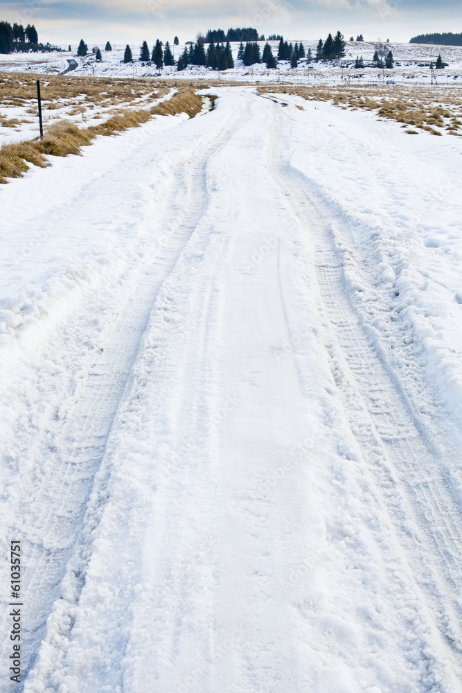 frozen winter asphalt road with snow frozen winter asphalt road with snow