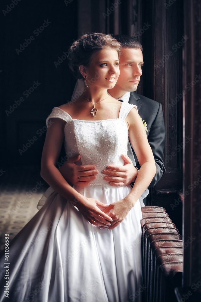 Fototapeta premium Newlyweds embraces