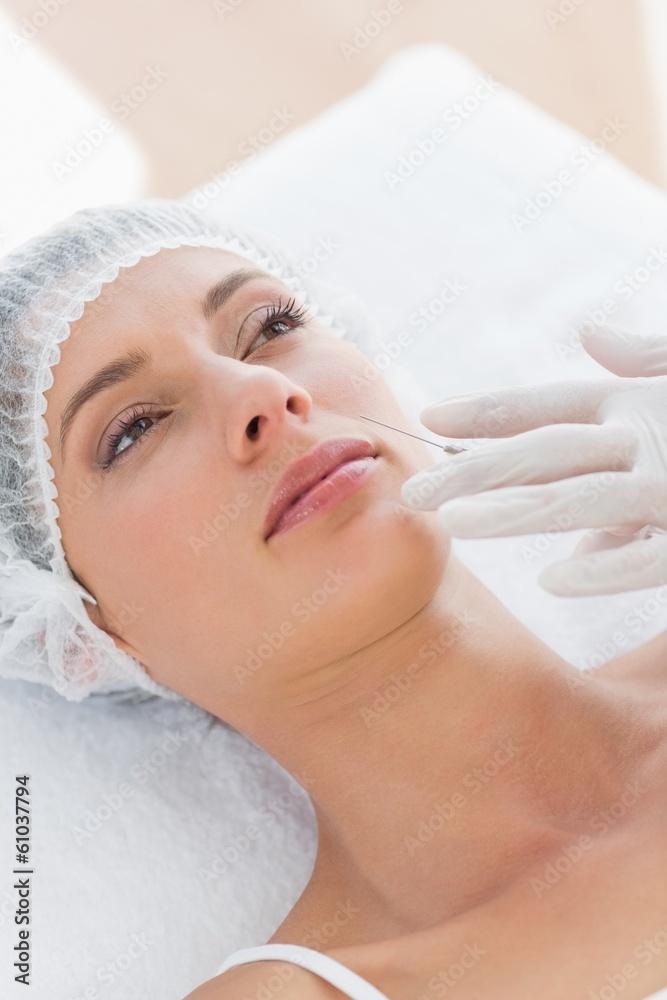 Beautiful woman recieving botox injection