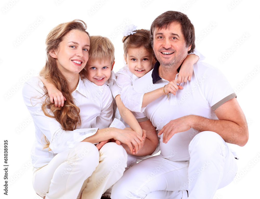 Beautiful happy family - isolated over a white Beautiful happy family - isolated over a white