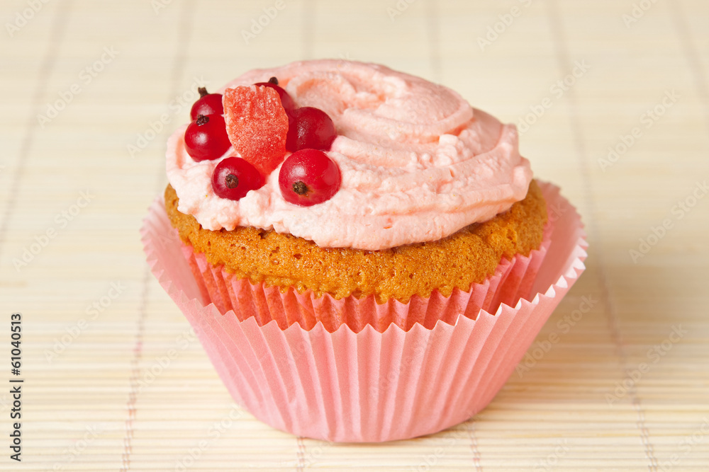 cupcake with whipped cream and redcurrant cupcake with whipped cream and redcurrant