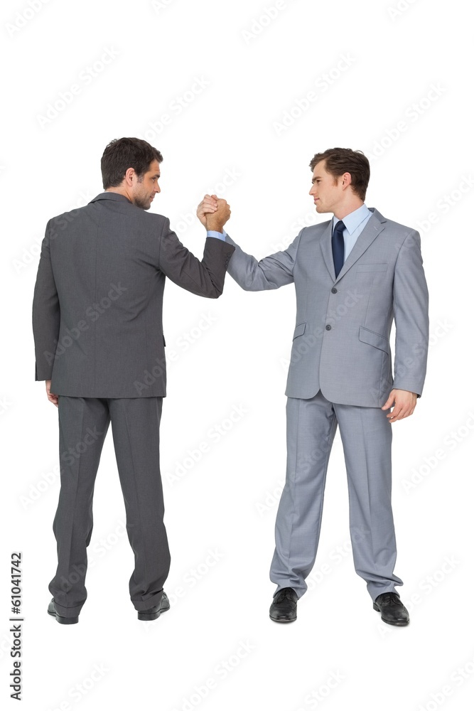 Smiling business team putting hands together Smiling business team putting hands together