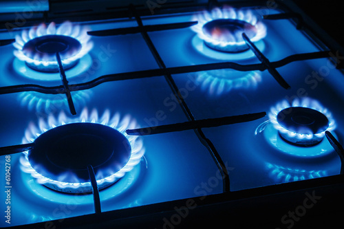 Blue flames of gas burning from a kitchen gas stove