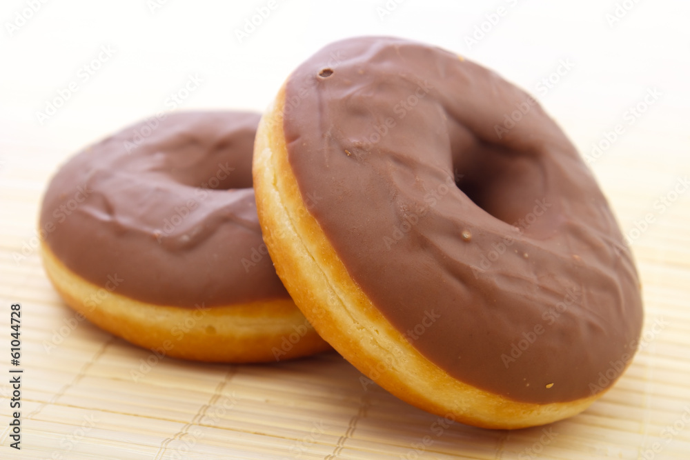 Chocolate donuts on place mat