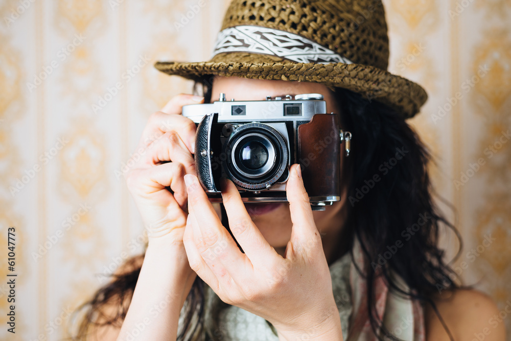 Female hipster taking photo with retro camera Female hipster taking photo with retro camera