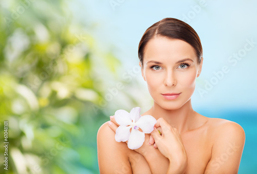 relaxed woman with orhid flower