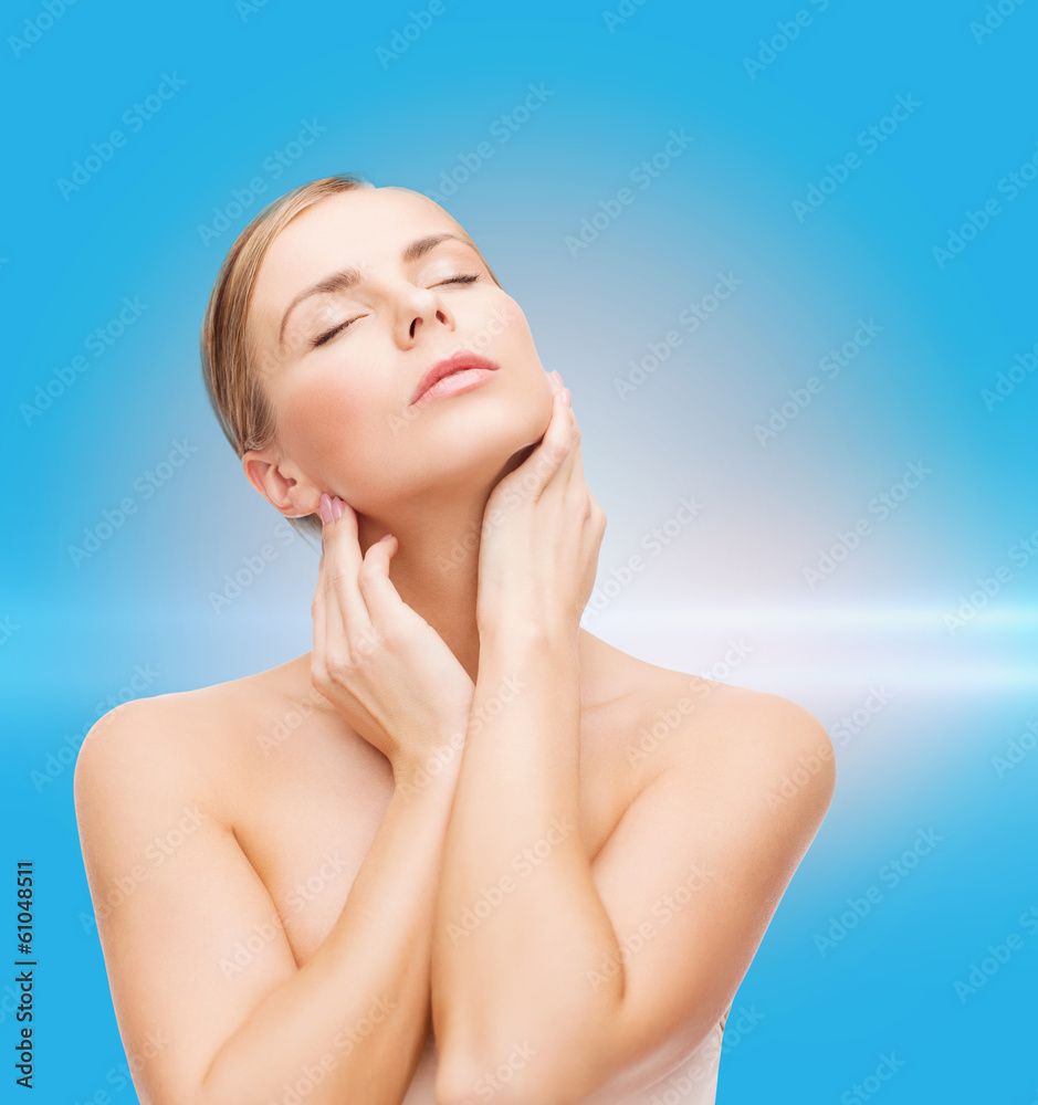 beautiful woman touching her face with closed eyes beautiful woman touching her face with closed eyes