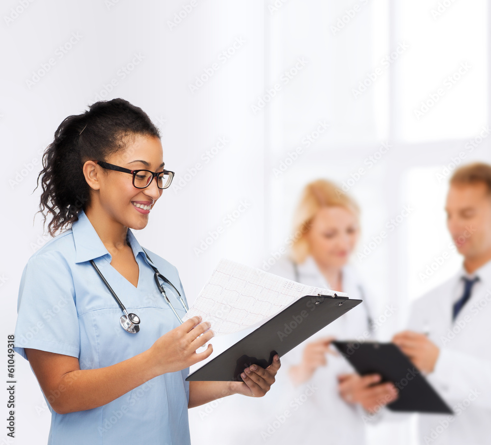 smiling female african american doctor or nurse smiling female african american doctor or nurse