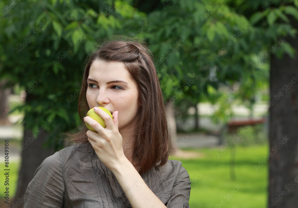 Portrait of a Woman Eating a Green Apple Portrait of a Woman Eating a Green Apple