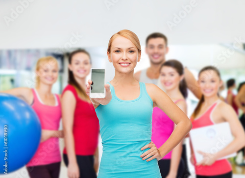 sporty woman with smartphone