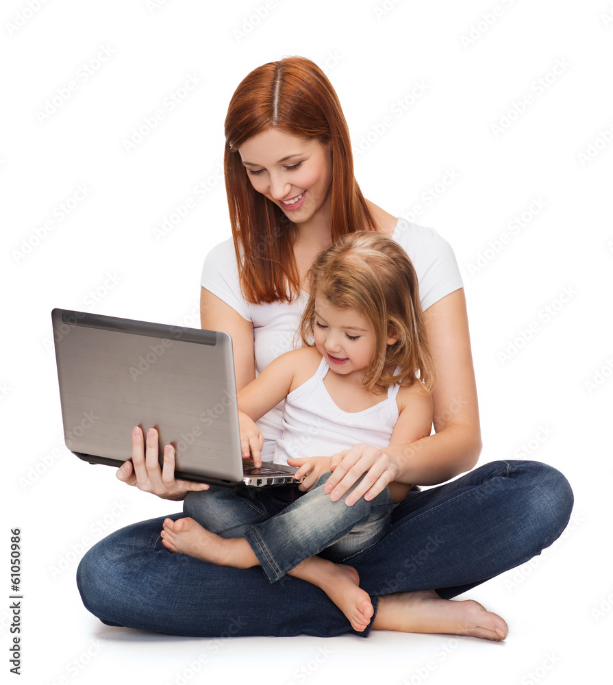 happy mother with adorable little girl and laptop happy mother with adorable little girl and laptop