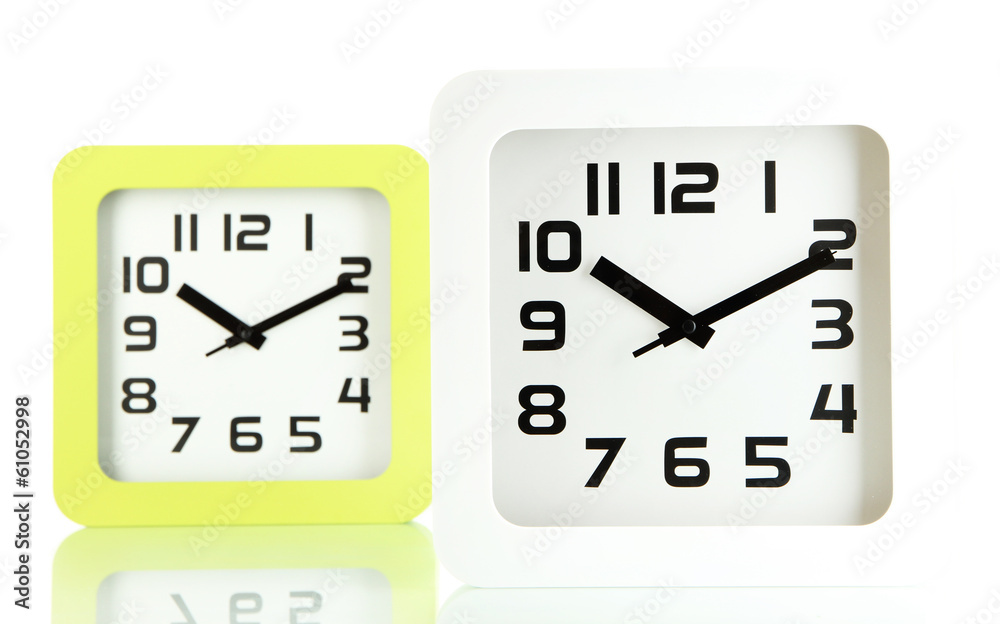 Fototapeta premium Two office clocks, isolated on white