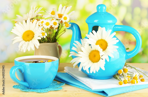 Fototapeta Naklejka Na Ścianę i Meble -  Beautiful bouquet chamomiles in teapot