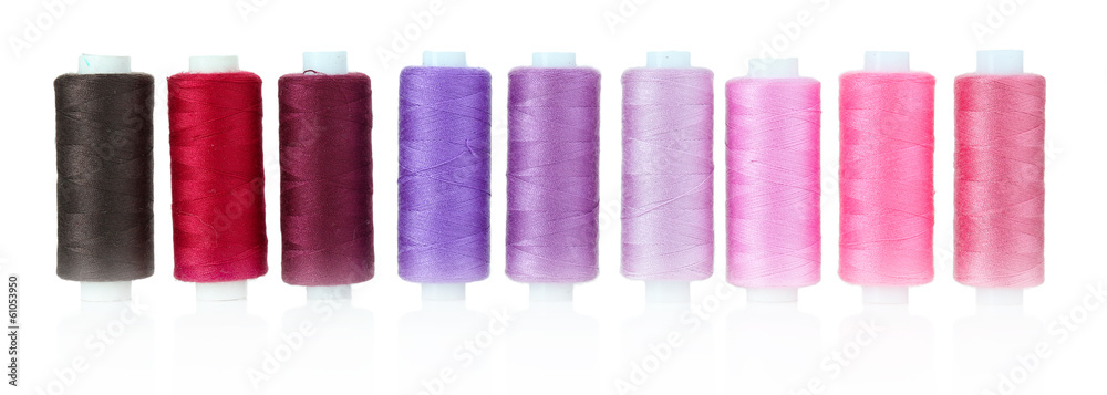 Colored spools of threads isolated on white Colored spools of threads isolated on white