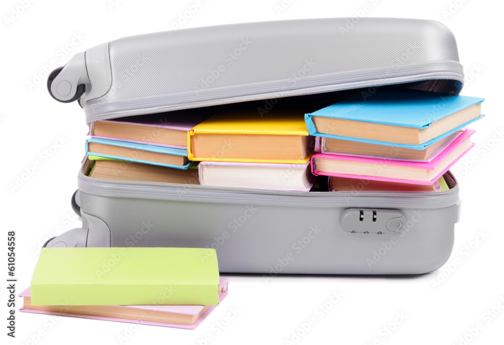 Suitcase with books isolated on white Suitcase with books isolated on white