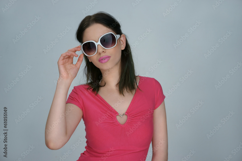 Woman in summer fashion with trendy sunglasses Woman in summer fashion with trendy sunglasses