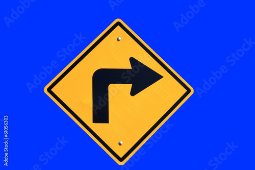 turn right yellow road sign on blue background
