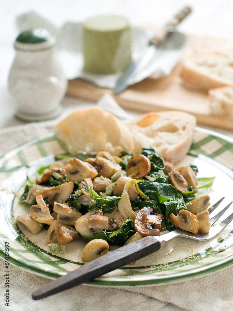 Spinach and mushroom salad with cheese, selective focus