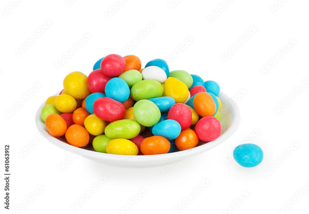colored candies in white saucer colored candies in white saucer
