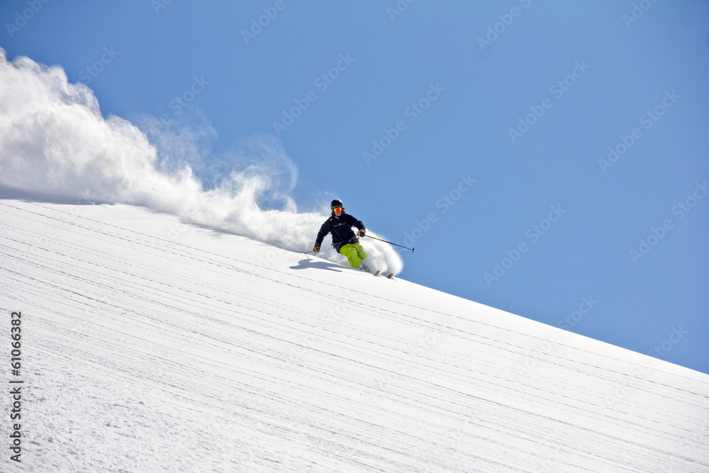 Skier in deep powder, extreme freeride