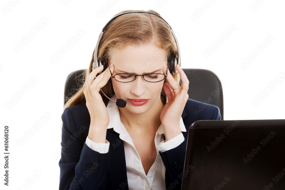 Tired business woman at call center sitting by the table. Tired business woman at call center sitting by the table.