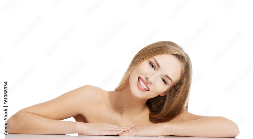Obraz premium Beautiful caucasian naked woman lying on a table.