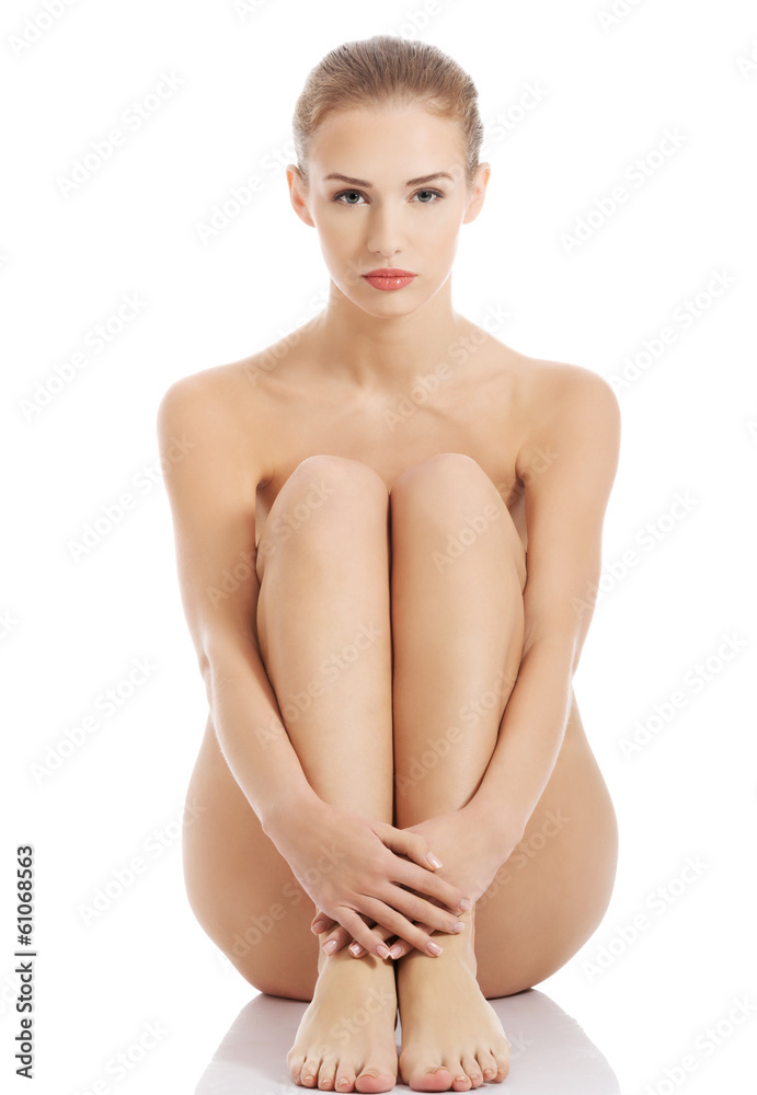 Fototapeta premium Beautiful caucasian naked woman sitting with fresh clean skin.