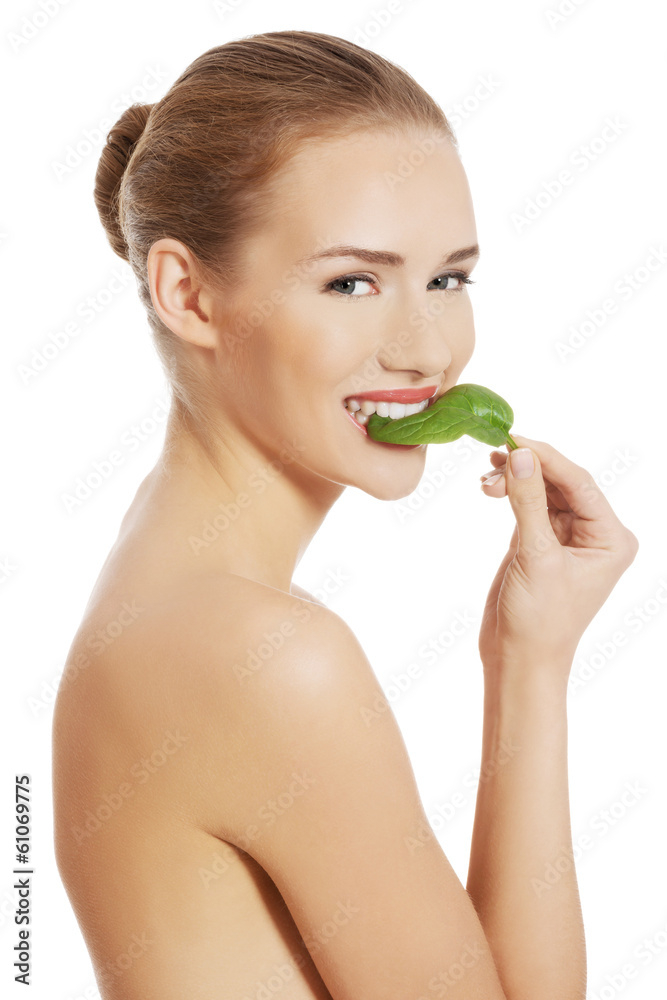 Beautiful caucasian topless woman with one green leaf. Beautiful caucasian topless woman with one green leaf.