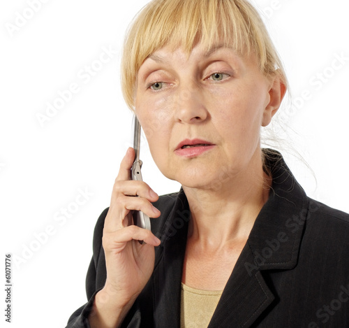 business woman listens to smb on mobile phone