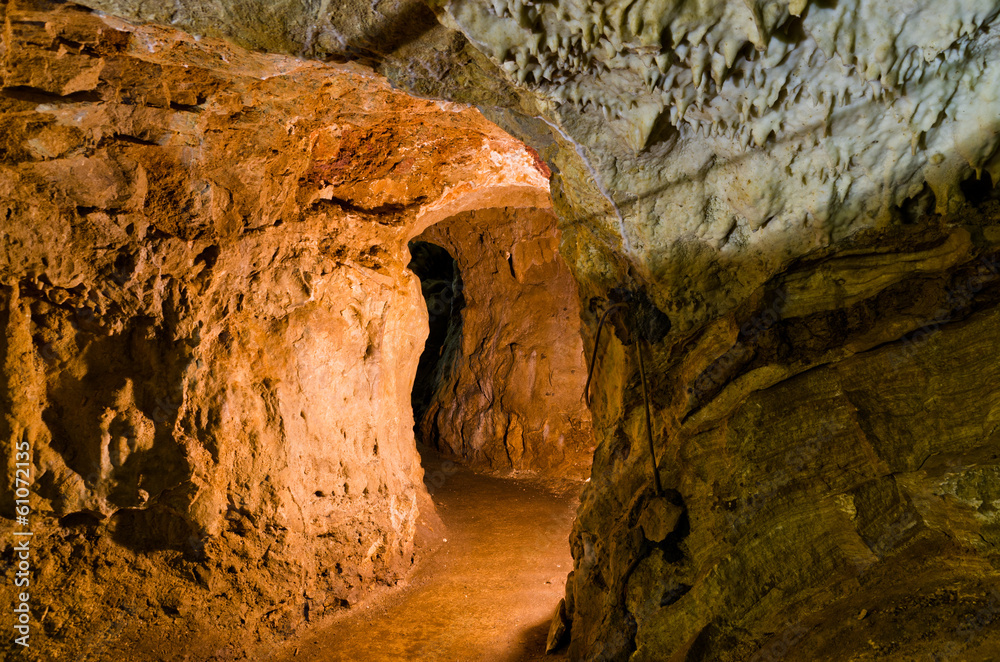Adventure through illuminated maze of underground cave corridors