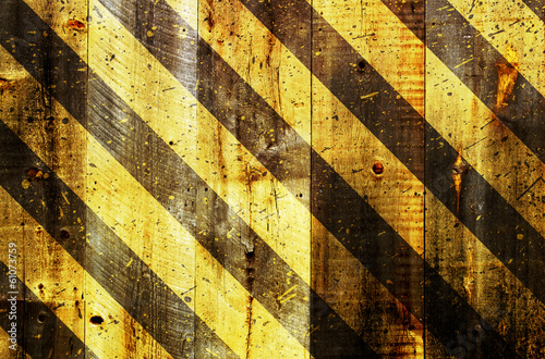 under construction strips on wooden background © VectorShots